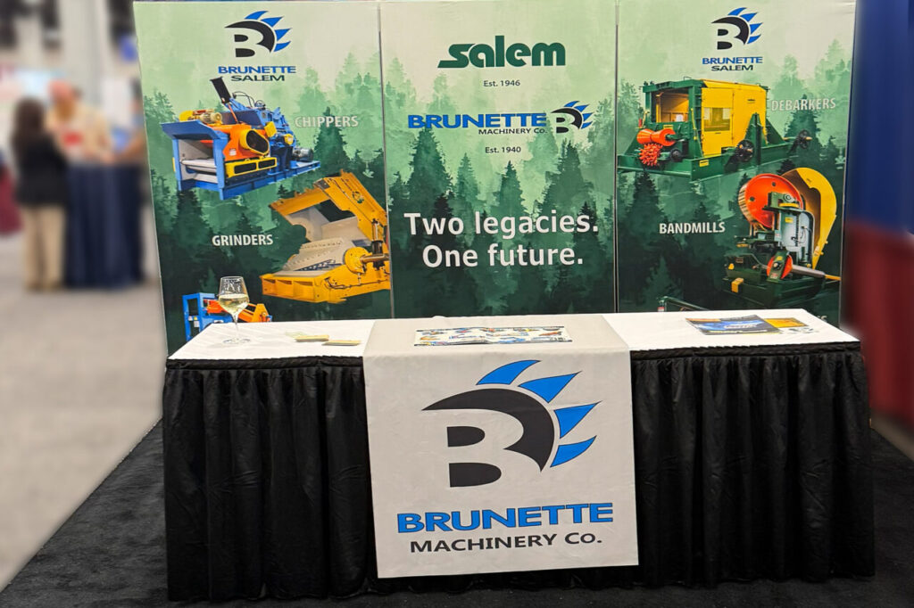 image describes the trade show booth set up. Includes three panels featuring the logo "Brunette Salem" and pictures of a wood chipper, a wood grinder, a band mill and a debarker on a background of evergreen trees